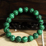 สร้อยข้อมือคริสตัลมาลาไคต์สีเขียว - แบบกลม - เครื่องประดับคริสตัล สร้อยข้อมือหินมีค่า ของขวัญพิเศษ สร้อยข้อมือลูกปัด สำหรับผู้ชาย ผู้หญิง บำบัด